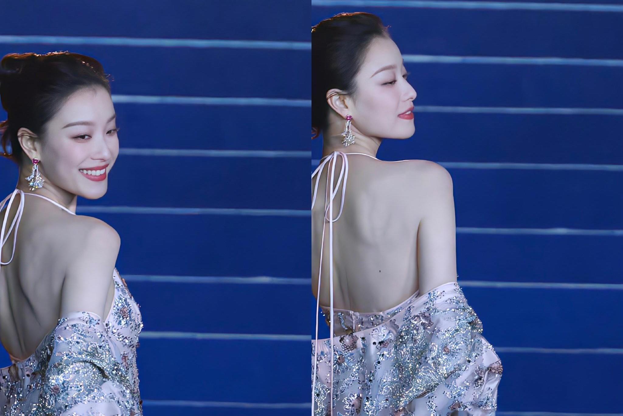 倪妮的肩胛骨美得耀眼 倪妮出席vogue盛典红毯,身穿立体花卉刺绣礼服