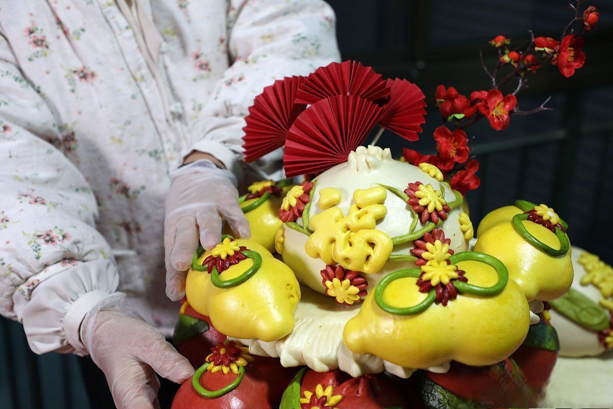 寓意财源广进 在山东省烟台福山区,春节的来临也意味着花饽饽的盛宴