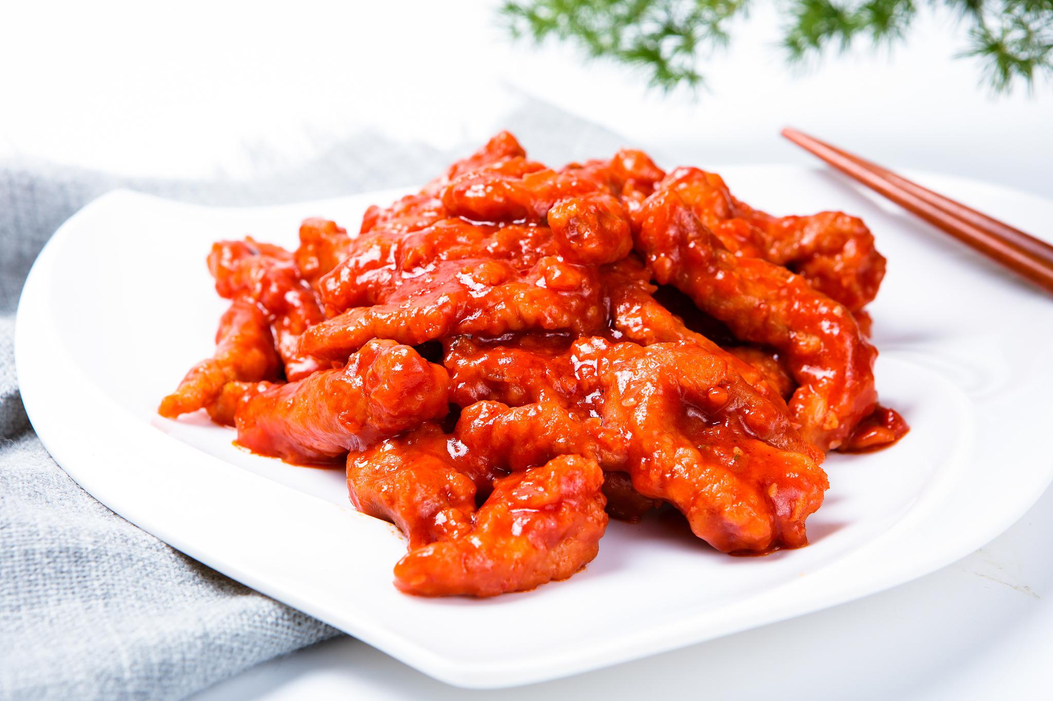 茄汁里脊:经典家常风味 茄汁里脊是一道色香味俱佳的经典家常菜,以猪